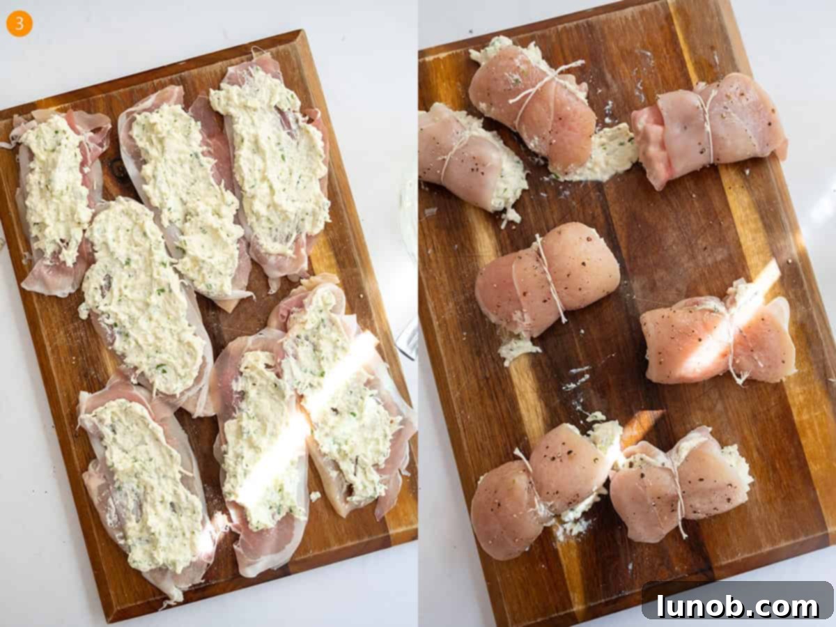 Spreading ricotta filling onto prosciutto-layered chicken, rolling it, and securing with kitchen twine.