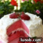 Slice of strawberry cake with mascarpone frosting