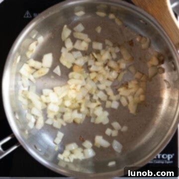 Sauteing onions in a pan.