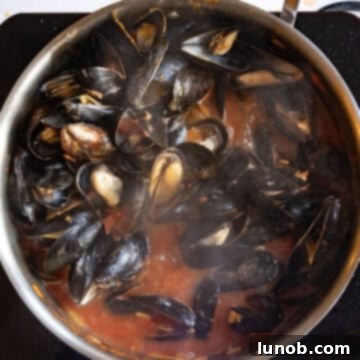 Mussesls steamed and opened in a pan with the fra diavolo sauce.