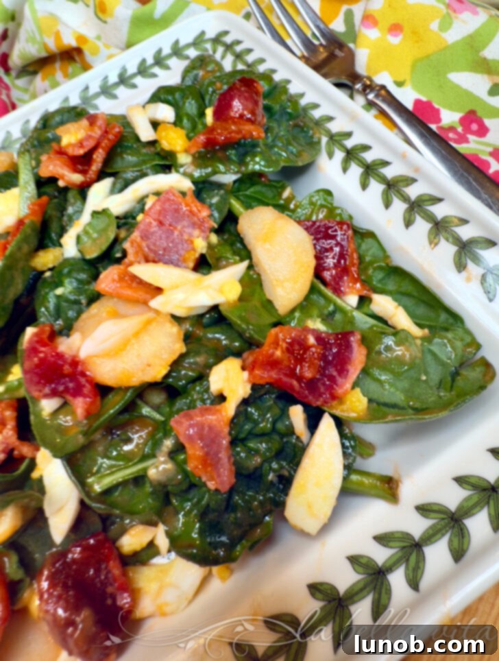 Spinach Salad with crispy bacon, hard-boiled eggs, and water chestnuts