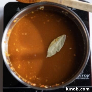 Authentic Italian Lentils 9 Chicken broth and a bay leaf added to the simmering lentils and vegetables.
