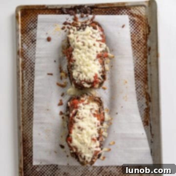 Eggplant layers topped with mozzarella and parmesan, toasted in the oven.