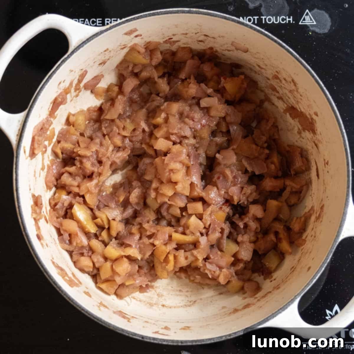 Golden Apple & Spice Chutney 9 Finished spiced apple chutney cooling in a dutch oven, ready for serving or jarring.