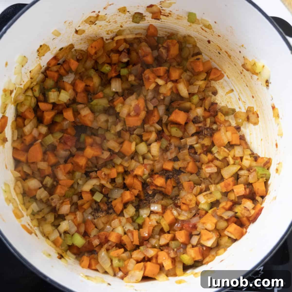 Traditional Italian Pasta Fagioli 6 The softened sofrito vegetables combined with caramelized tomato paste in the Dutch oven, creating a rich base.