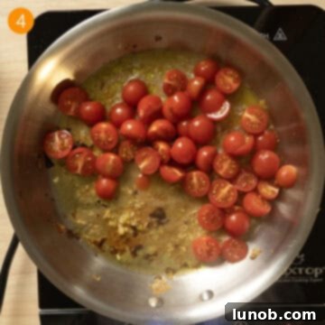 Rustic Eggplant Tomato Pasta 7 Cherry Tomatoes and white wine added to pan to simmer with garlic.