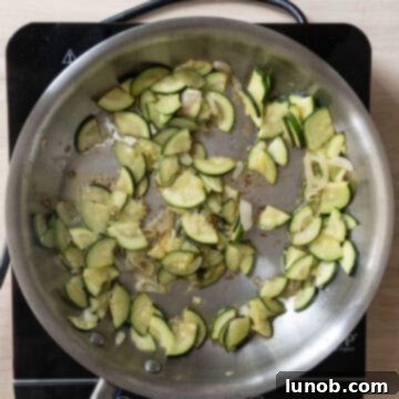 Zucchini sauteing with shallots.