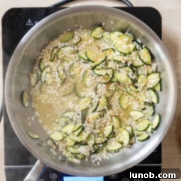 White wine simmering with arborio rice.