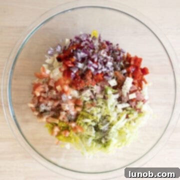 Combined vegetables and meat for the salad.