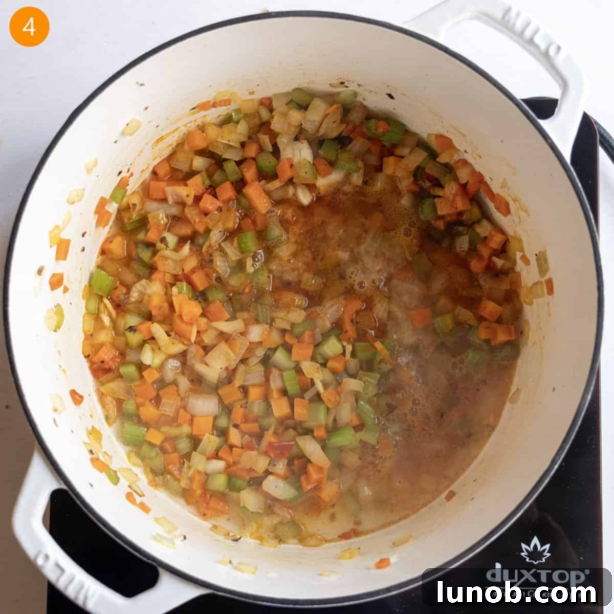 Hearty Broccoli Rabe and Tortellini Soup 7 Deglazing pan with white wine.