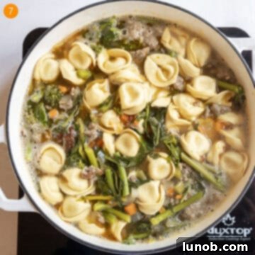 Boiling tortellini in soup.