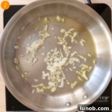 Sauteing onions in a pan.