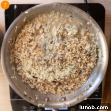 Tossing risotto with gorgonzola and butter.