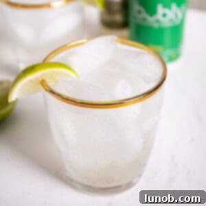Non alcoholic moscow mule in a glass, garnished with a lime.