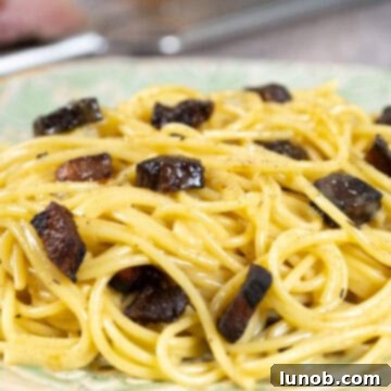 The Art of Perfect Carbonara 17 Burnt guanciale in a pan, an undesirable outcome for carbonara.