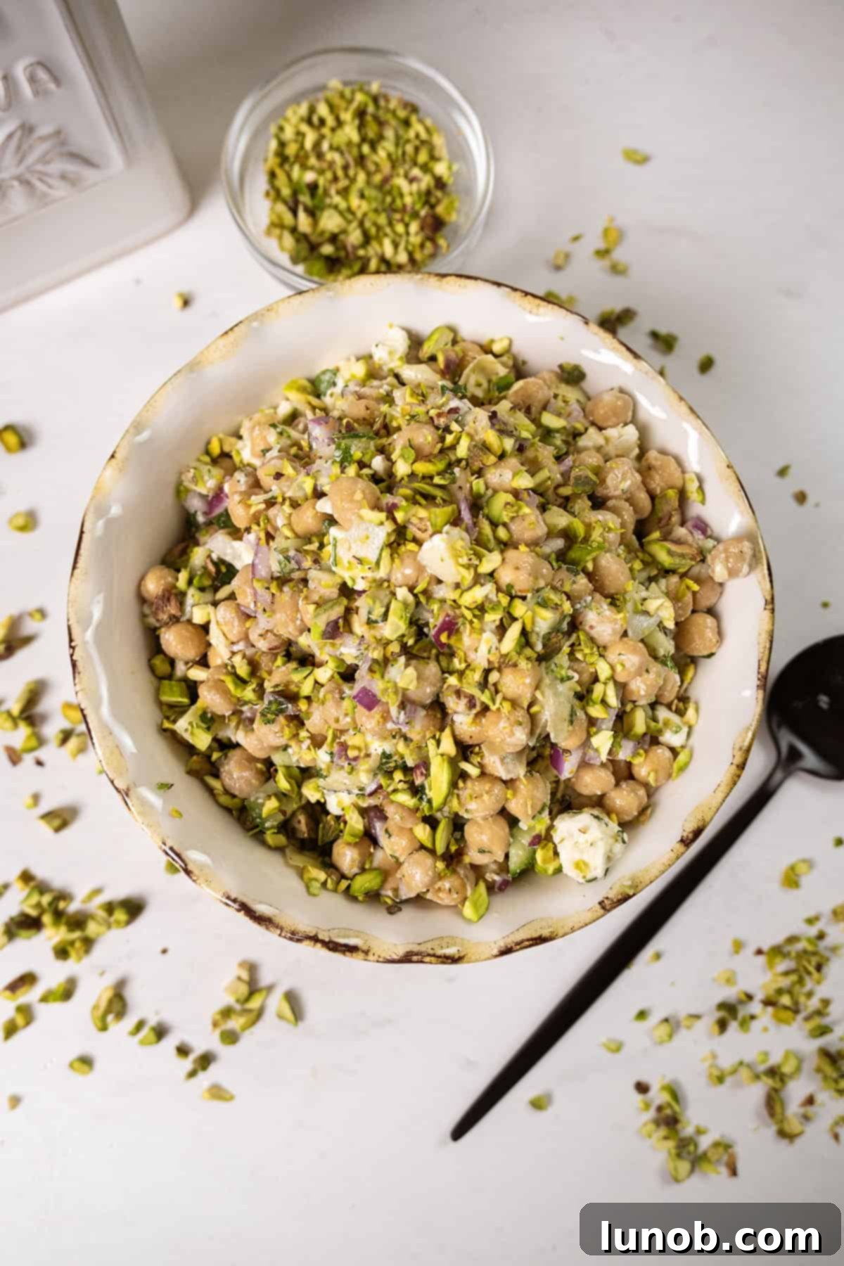 Chickpea salad with cucumbers in a bowl. 