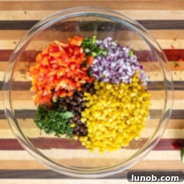 Texas Caviar Salad 4 Vegetables and beans combined in a bowl.
