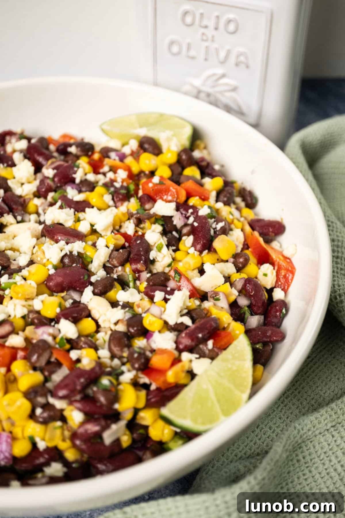 Texas Caviar Salad 7 Cowboy caviar salad in a bowl, garnished with limes.