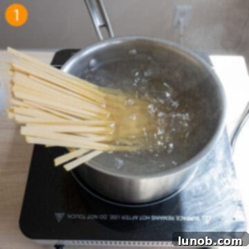 Traditional Roman Fettuccine Alfredo 4 Boiling fettuccine pasta in a large pot of salted water.