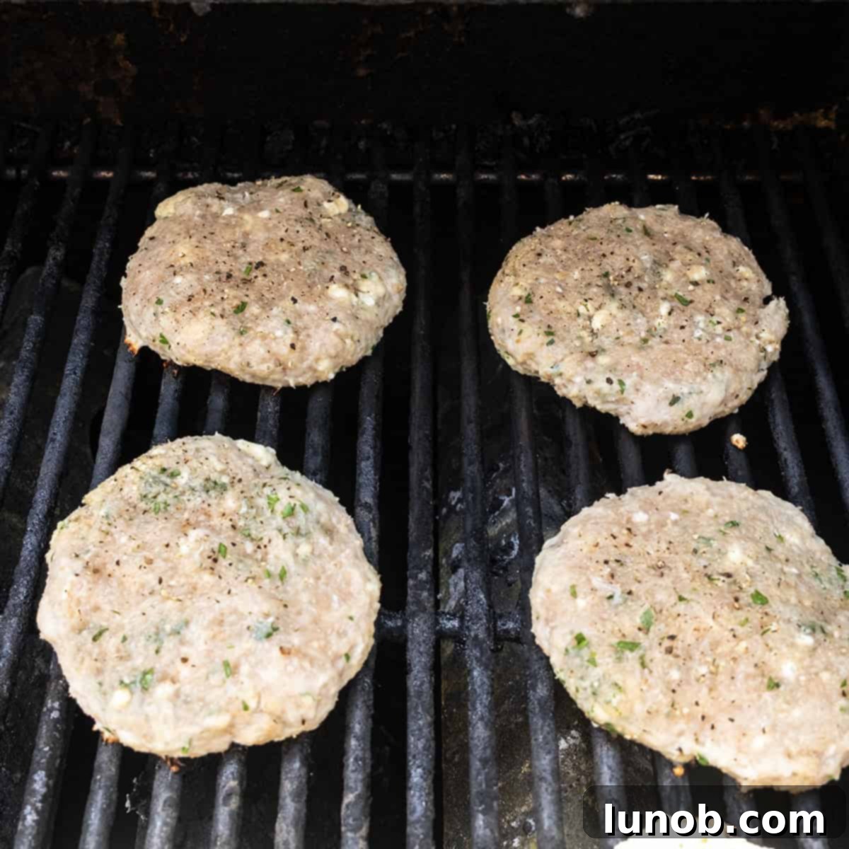 Gourmet Gorgonzola Grilled Chicken Burger 6 Grilling Chicken burgers on the grill.