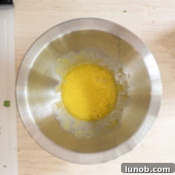 Gourmet Gorgonzola Grilled Chicken Burger 7 Slowly whisking olive oil, egg yolk, and garlic.