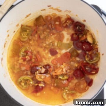 Fiery Chicken Rigatoni 9 Chopped cherry peppers, cherry pepper juice, and white wine added to the sautéed aromatics in the saucepan, simmering gently.