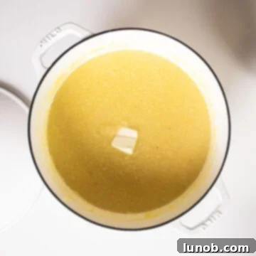 Velvety Golden Polenta 7 Polenta removed from the heat combined with butter and parmigiano.