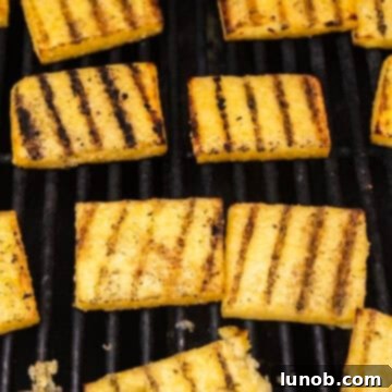 Grilling polenta with grill marks.