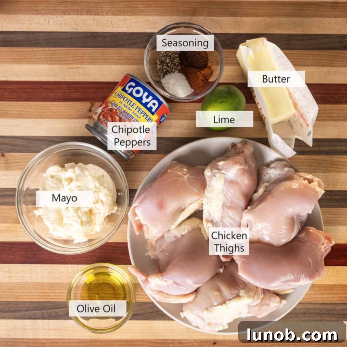 Dynamite Chicken Skewers 3 Array of fresh ingredients for Bang Bang Chicken Skewers, including chicken thighs, spices, and chipotle mayo components.