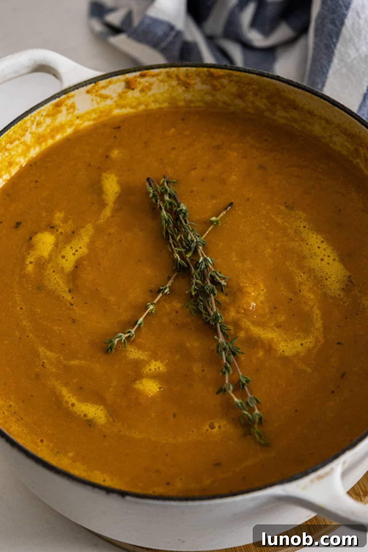Sweet and Zesty Roasted Carrot Ginger Soup 9 roasted carrot ginger soup topped with fresh thyme