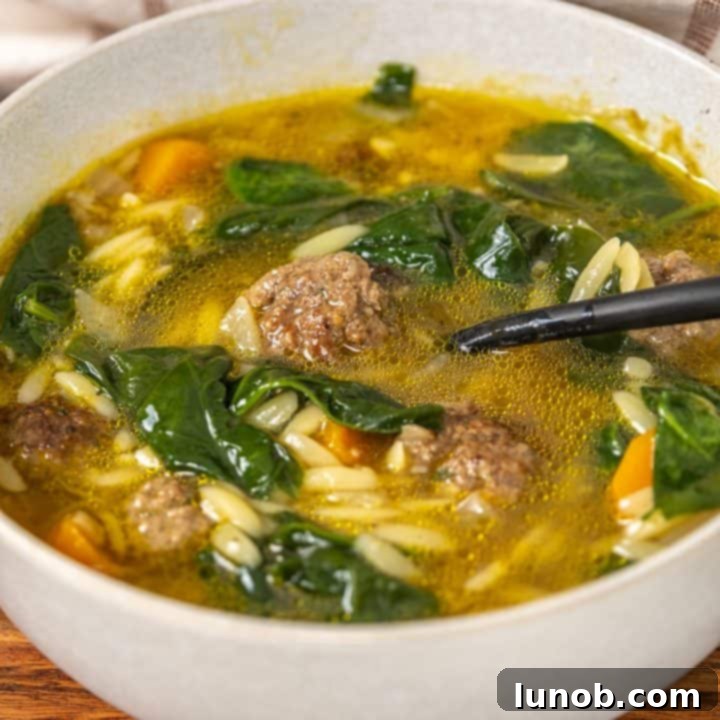 Classic Italian wedding soup with mini meatballs and green escarole.