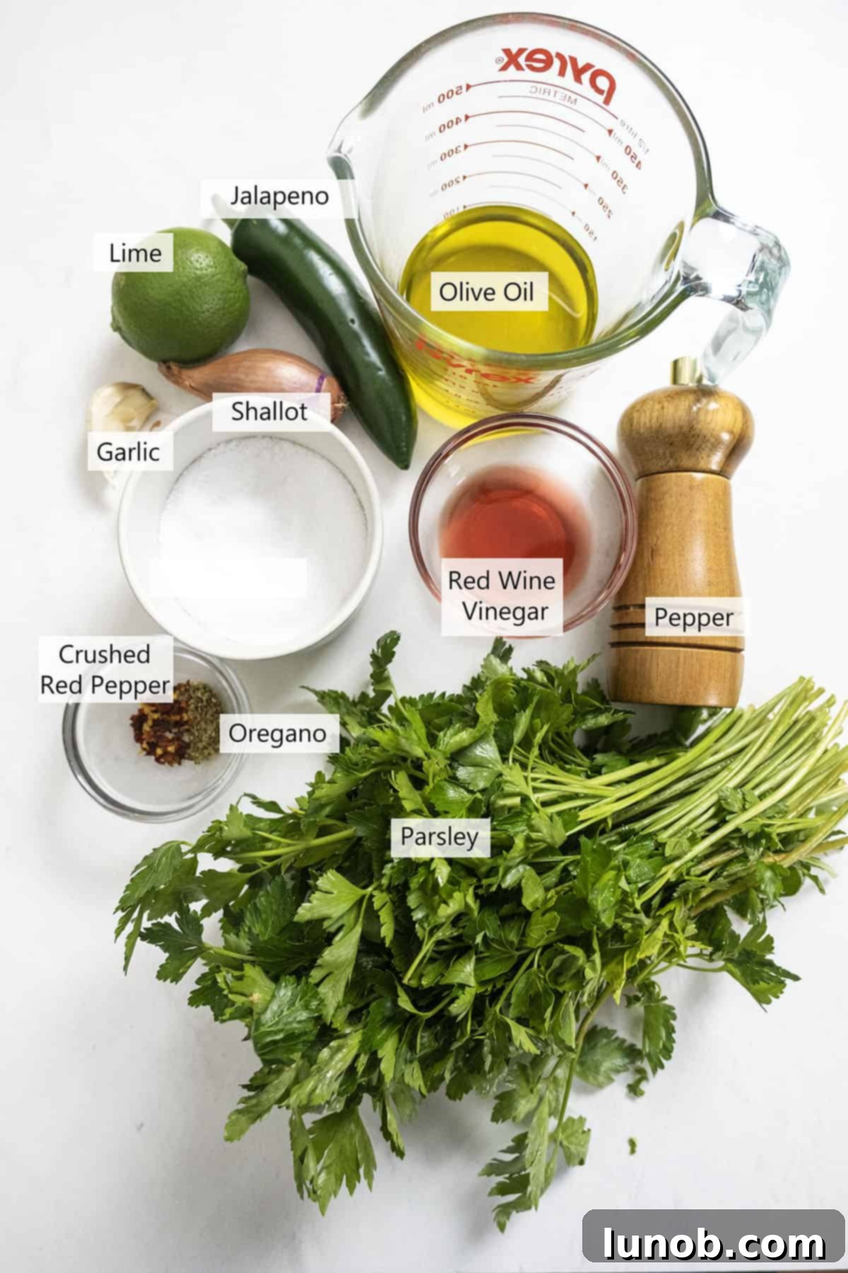 Vibrant Chimichurri Steak Tacos 3 Fresh ingredients for homemade chimichurri sauce, including parsley, jalapeno, lime, shallot, garlic, and red pepper flakes.