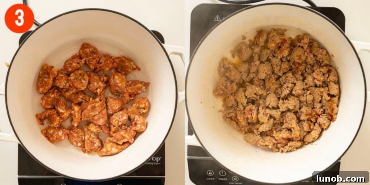 Ground Italian sausage browning in a large Dutch oven on the stovetop.