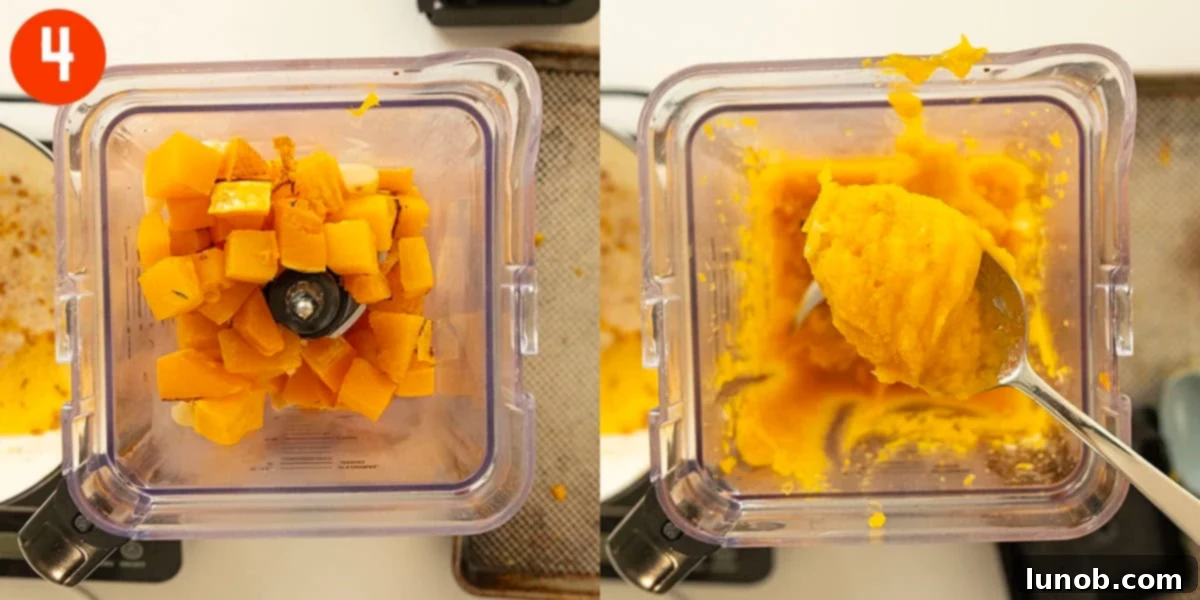 Roasted butternut squash and garlic being blended with chicken broth into a smooth puree in a high-speed blender.