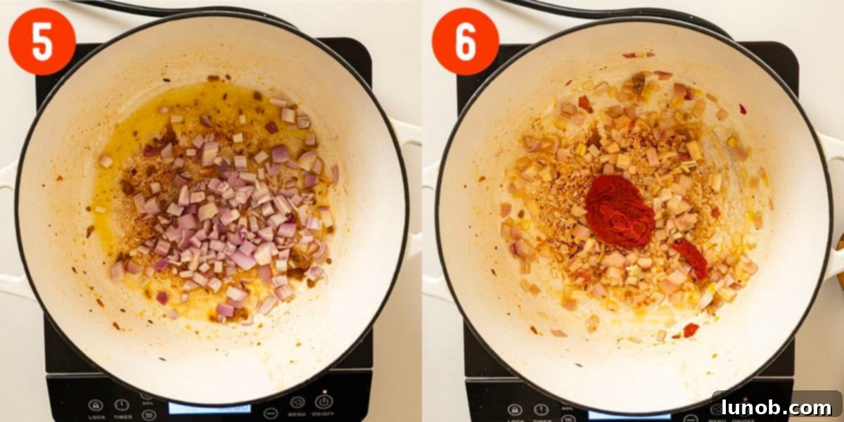 Chopped shallots and tomato paste sautéing in a Dutch oven on the stovetop.