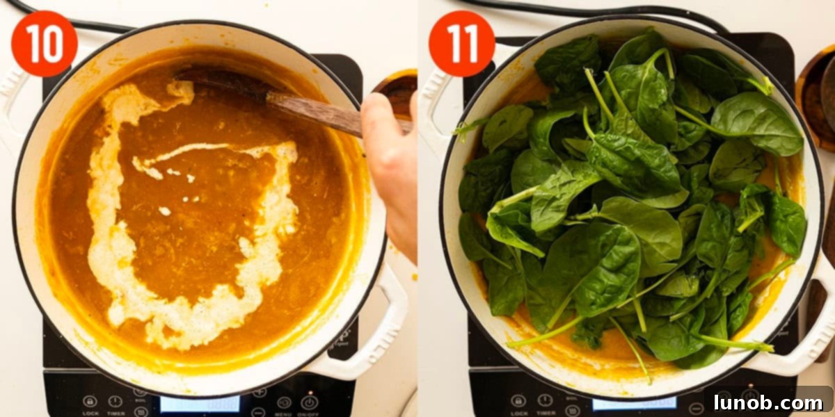 Fresh baby spinach and heavy cream being stirred into the finished butternut squash soup.