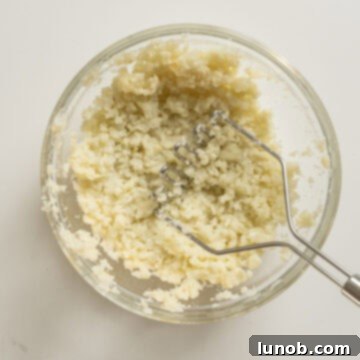 Crispy Cauliflower Fritters 5 Mashed cauliflower in a bowl.