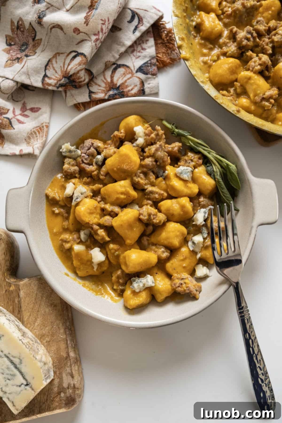 Pumpkin Gnocchi Perfection 2 Gnocchi with creamy pumpkin sauce and sausage, topped with gorgonzola.