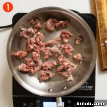 Pumpkin Gnocchi Perfection 4 Searing sausage in a saucepan, forming a crust.