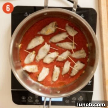 Savory Stuffed Squid 9 Simmering calamari in tomato sauce.